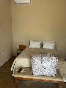 Ένα ή περισσότερα κρεβάτια σε δωμάτιο στο Los Kinotos Mini Casa Chuy