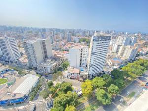 an overhead view of a city with tall buildings at Vista piso 24 in Lima