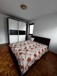 a bedroom with a large bed in a room at Comfort&Peace in Sarajevo