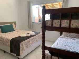 Ένα ή περισσότερα κρεβάτια σε δωμάτιο στο Condomínio Casa do Lago - Casas Completas +26 φωτογραφίες