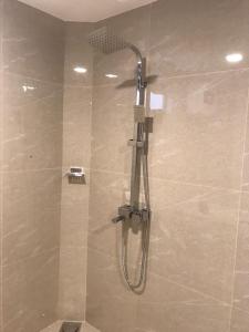 a shower with a shower head in a bathroom at Chaya Beach Hotel,Tangalle in Tangalle +40 photos