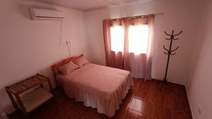 Ένα ή περισσότερα κρεβάτια σε δωμάτιο στο El Rincón del Cielo