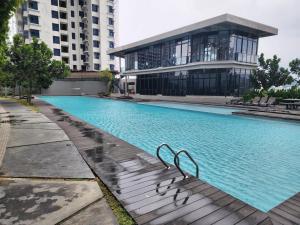 a large swimming pool in front of a building at Astoria 4r3b 5minsklcc bathtub waterfilter newcondo bigbalcony in Ampang