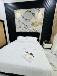 Ένα ή περισσότερα κρεβάτια σε δωμάτιο στο Zafriel homestay kemaman