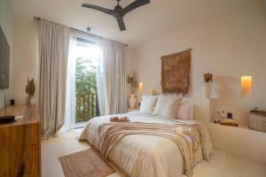 Postel nebo postele na pokoji v ubytování Nãmas Tulum + 37 fotografií