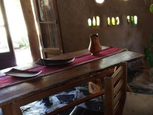 a table with plates and a vase on top of it at Casa Madre in Villa Yacanto +21 photos