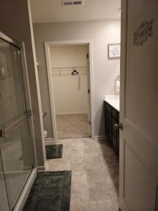 a bathroom with a walk in shower and a sink at Elizabethtown Charm in Elizabethtown +17 photos