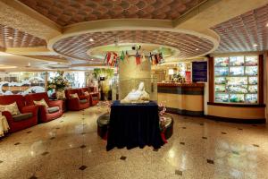 a lobby of a store with a table and chairs at Chungli Business Hotel in Zhongli