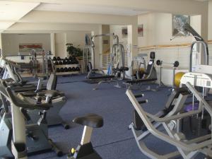 a gym with several treadmills and exercise bikes at 202 Kylemore A Waterfront Marina in Cape Town