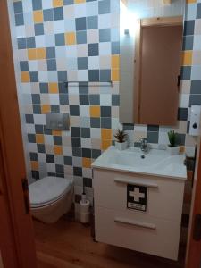 a bathroom with a toilet and a sink at Casa da Saudade in Ferreira do Zêzere +27 photos