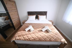 Postel nebo postele na pokoji v ubytování Apartman Bašić