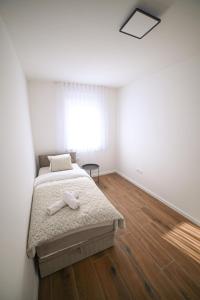Postel nebo postele na pokoji v ubytování Apartman Bašić