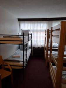 Rúm í herbergi á Ferienheim Sorgenfrei