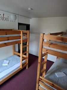 Rúm í herbergi á Ferienheim Sorgenfrei
