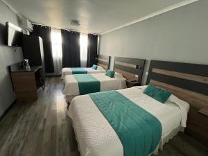 Ένα ή περισσότερα κρεβάτια σε δωμάτιο στο Hotel Real