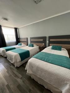 Ένα ή περισσότερα κρεβάτια σε δωμάτιο στο Hotel Real