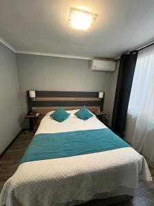 Ένα ή περισσότερα κρεβάτια σε δωμάτιο στο Hotel Real