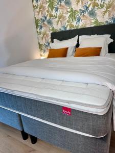 a mattress on a bed frame in a bedroom at RELAX HOME Maison et studio ensemble in Deauville