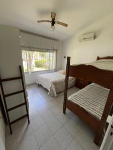 En eller flere senger på et rom på Casa en balneario Costa Azul a 2 cuadras de la playa