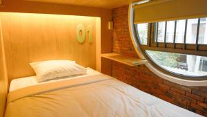 Postel nebo postele na pokoji v ubytování Leaf Sustainable Hostel