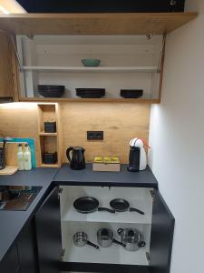 a small kitchen with a stove top oven at Stan na dan Nina Plus - Pale Centar in Pale +16 photos