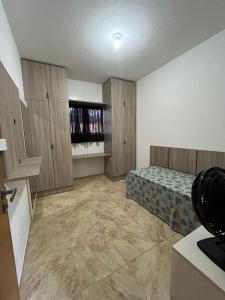 Katil atau katil-katil dalam bilik di Casa de temporada conforto ao mar de Cabo Branco