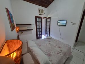 Postel nebo postele na pokoji v ubytování Pousada Brilho De Paraty