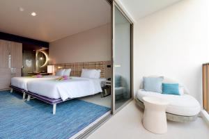 เตียงในห้องที่ Veranda Resort Pattaya - MGallery Collection