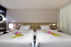 เตียงในห้องที่ Veranda Resort Pattaya - MGallery Collection