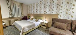 Ένα ή περισσότερα κρεβάτια σε δωμάτιο στο Angella KOP Konaci