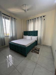 Ένα ή περισσότερα κρεβάτια σε δωμάτιο στο Aura Homes