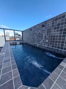 a swimming pool on the roof of a building at Relax en Colegiales in Buenos Aires
