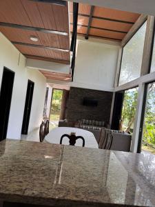 a dining room with a table and some chairs at EL MILAGRO FINCA VACACIONAL in San Rafael