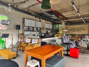 a store with a table and chairs in a room at Voss Condominium in Manila
