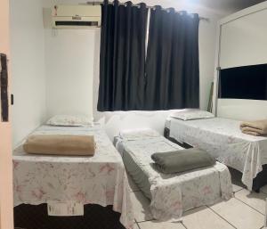 Postel nebo postele na pokoji v ubytování Apartamento da Paty