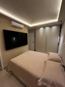 Postel nebo postele na pokoji v ubytování Apartamento dos Sonhos