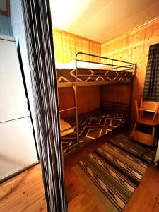 a room with a bunk bed in a room at Turifoss Camping Cabin 1 in Meråker