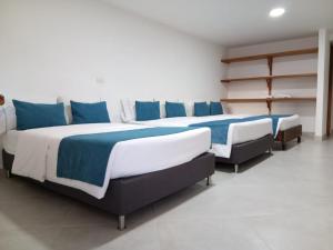 Postel nebo postele na pokoji v ubytování Hotel Santa Laura