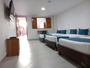 Postel nebo postele na pokoji v ubytování Hotel Santa Laura
