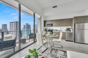 an apartment kitchen with a view of a city at City Views Studio Downtown Miami in Miami
