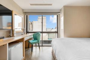 Postel nebo postele na pokoji v ubytování Mu Chen Hotel