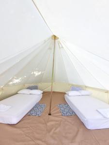 Postel nebo postele na pokoji v ubytování Glamping Jarahuco