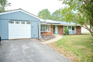 a house with a white garage and a driveway at Home away from Home in Waldorf