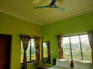 Ένα ή περισσότερα κρεβάτια σε δωμάτιο στο Bonobitan Home Stay