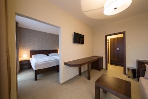 Postel nebo postele na pokoji v ubytování Hotel Polianka