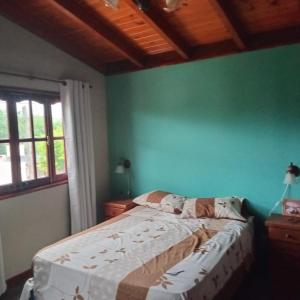 En eller flere senge i et værelse på Mis 4 Soles