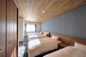 Postel nebo postele na pokoji v ubytování Villas Fuji Sengen ヴィラス富士浅間