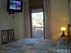 Cama o camas de una habitación en Apartamentos Turisticos Sol y Nieve