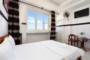 Postel nebo postele na pokoji v ubytování Lam Sơn Hotel 3 Tháng 2