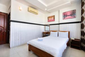 Postel nebo postele na pokoji v ubytování Lam Sơn Hotel 3 Tháng 2